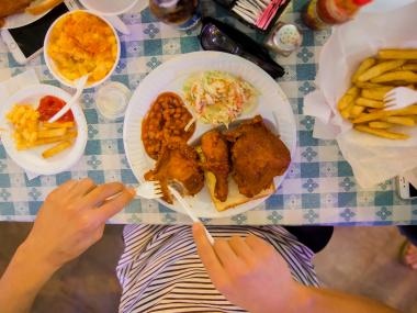 Girl eating Gus's Fried Chicken