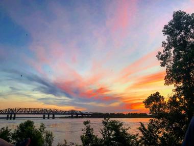 Blue, purple, and pink sunset view of MS River