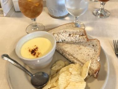 lunch plate of corn chowder, chicken salad sandwich, and potato chips