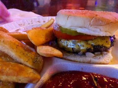 cheeseburger with seasoned fries from Alex's Tavern