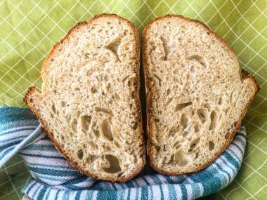 homemade sourdough bread loaf cut in half