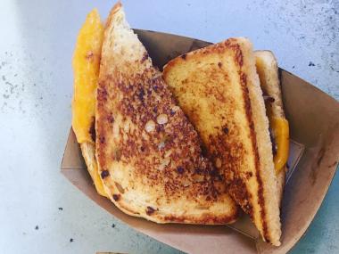 grilled cheese sandwich from Fuel Food Truck, cut in two