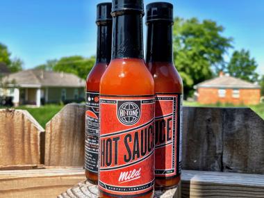 three bottles of Hi Tone branded hot sauce