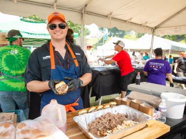 Chef preparing barbecue at the World Championship Barbecue Cooking Contest.