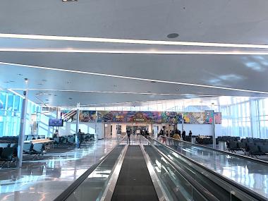 airport concourse with people mover conveyor