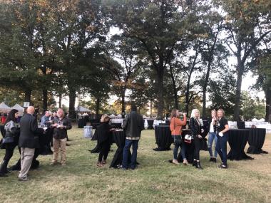 crowd of people on grassy lawn at Botanic Garden