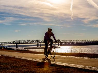 Biker along the riverfront | Craig Thompson