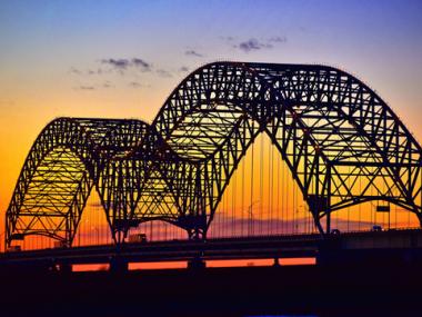 Memphis bridge during the sunset with orange and blue skies