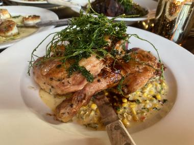 brick chicken on a bed of smoked cream cheese