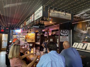 people sitting at momma's bar