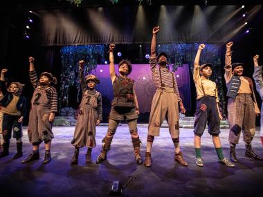 performers on stage posing