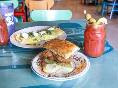 A biscuit, omelet and Bloody Mary on a table at Sunrise Memphis.