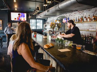 people sitting at bar at BarWare