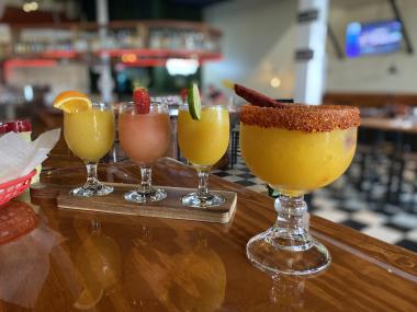 margarita flight next to large mango margarita