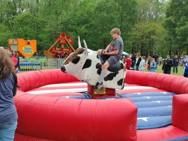 Shelby Forest Spring Fest boy riding mechanical bull