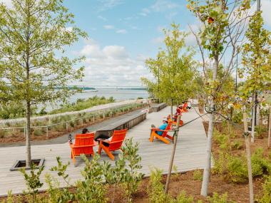 lawn chairs line the Mississippi River at tom lee park