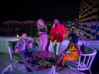 Friends at the rooftop bar Beck and Call at Hyatt Beale Street Memphis.