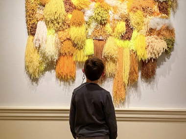 child looks at art in the Dixon gallery