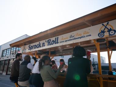 back of people riding on peddle tavern