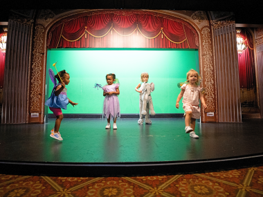 kids play on theatre stage at children's museum of memphis