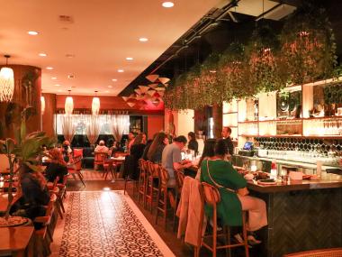 restaurant interior of Bao Toan with guests seated at tables and bar