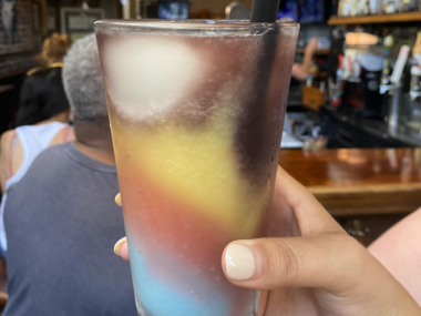multi-colored slushie in glass