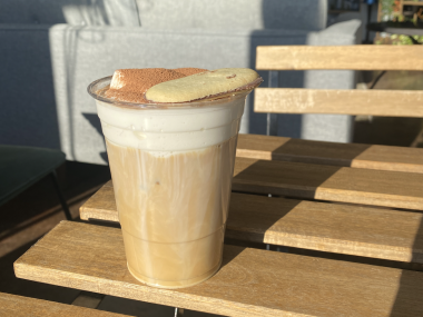 coffee on table at dr. beans with a biscoff cookie on it