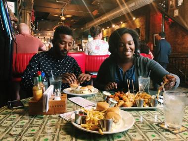 two people with several plates in front of them
