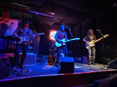 band on stage performing during International Blues Challenge