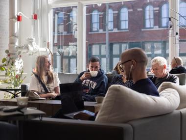 people sitting and enjoying coffee at Dr. Bean's