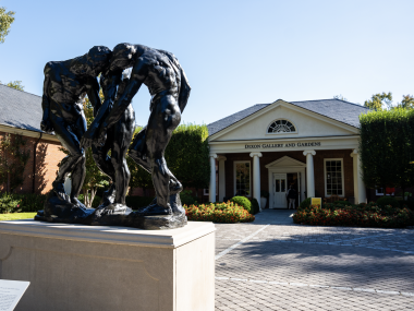 dixon exterior entrance with statue of three people hunched over