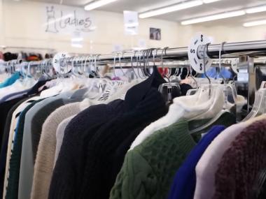 clothes hanging on rack at Repeat Boutique