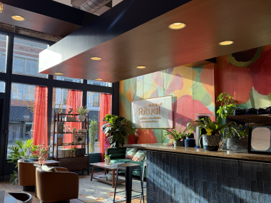 ritual coffee dining space and sidebar with colorfully painted wall