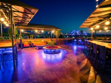 pyramid rooftop patio with fire pits and seating