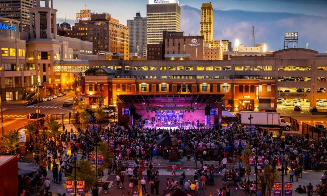 view of stage at Handy Park during outdoor live concert and downtown Memphis skyline